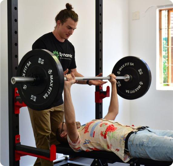 A chiropractitioner displaying Lifting and exercise techniques